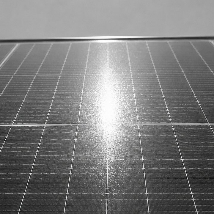 Real reflection of the sun on a PV module field, stretched lengthwise